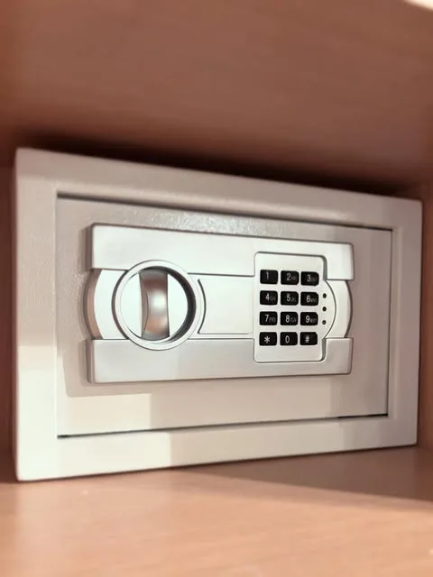 A digital wall safe fitted flush into a fitted cupboard
